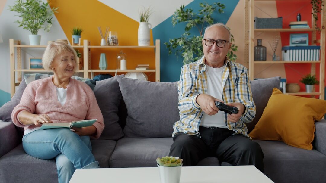 Elderly couple reviewing documents together at home